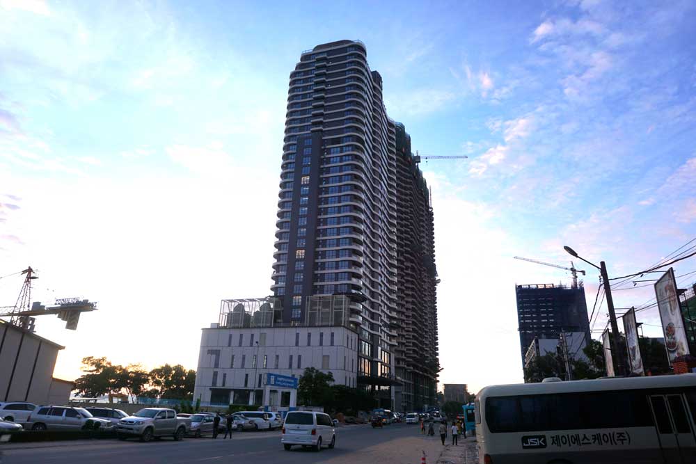 A modern construction tower in downtown Sihanoukville. Of the $1.3 billion invested in Sihanoukville in 2017, $1.1 billion came from China. Photo: RFA
