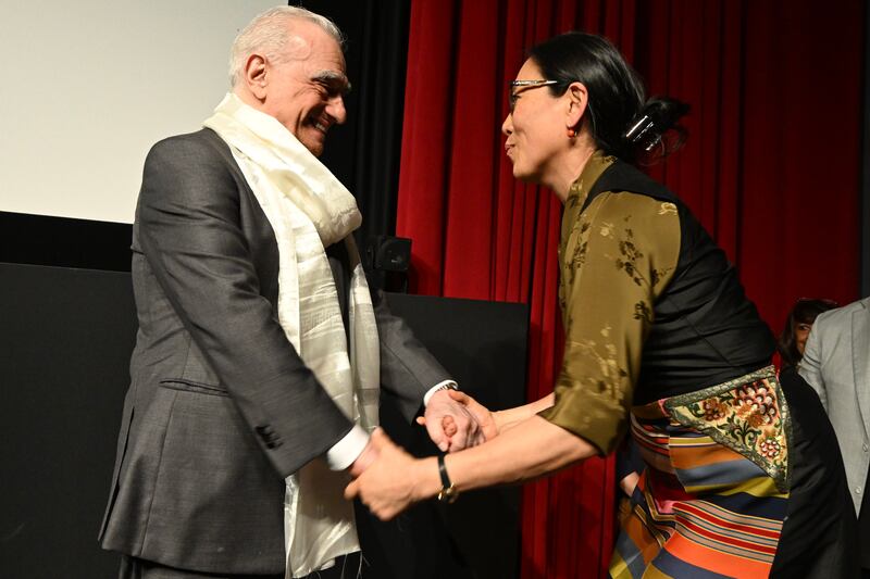 Tencho Gyatso, the President of the International Campaign for Tibet, presents a Tibetan ceremonial white silk scarf to Martin Scorsese at the screening of Kundun at the Tribeca Film Festival in New York on June 6, 2025. Gyatso, who is the Dalai Lama’s niece, also portrayed the Tibetan spiritual leader’s mother, her own grandmother, in Kundun.