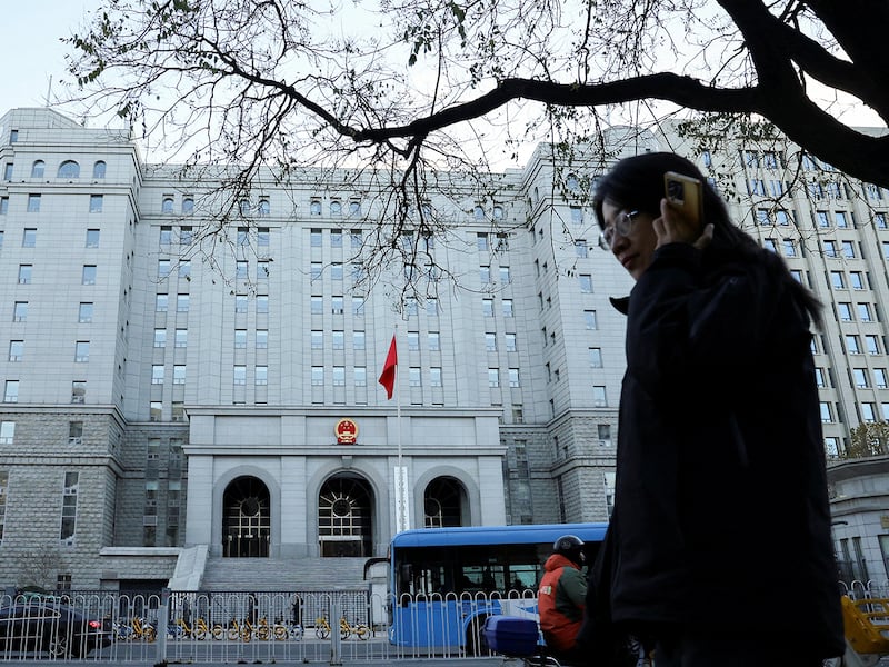 A pedestrian walks past Beijing No. 2 Intermediate People's Court, where former Chinese journalist Dong Yuyu received his verdict for espionage charges, in Beijing, Nov. 29, 2024.