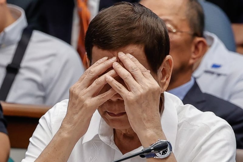 Former Philippine President Rodrigo Duterte gestures while testifying at a Senate hearing on his administration’s drug war, in Manila, Oct. 28, 2024.